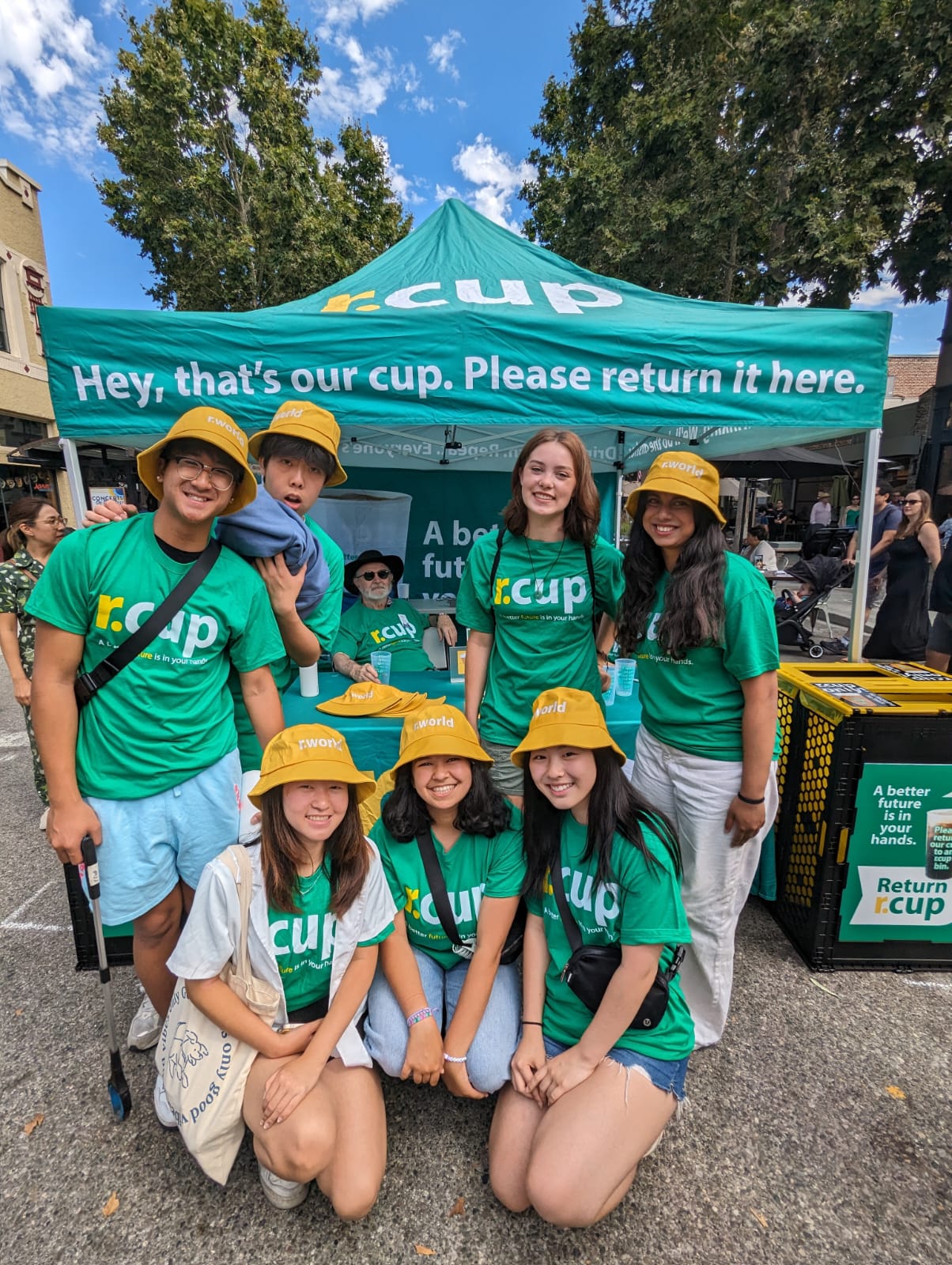 ReThink Disposable volunteers posing in front of returnable cup tent