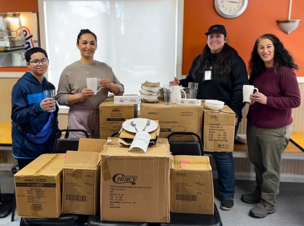 Image of people holding reusable serviceware items