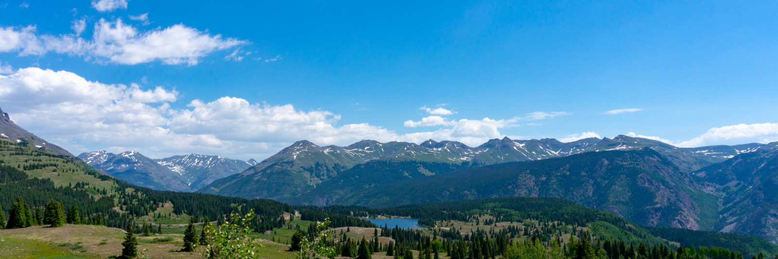 Colorado Mountains, lake, and trees at San Juan National Forest. 