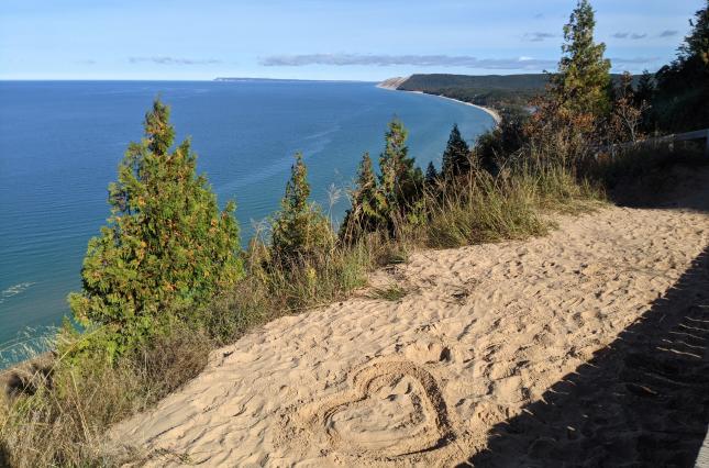 Heart drawn in sand on bluff overlooking Sleeping Bear National Lakeshore