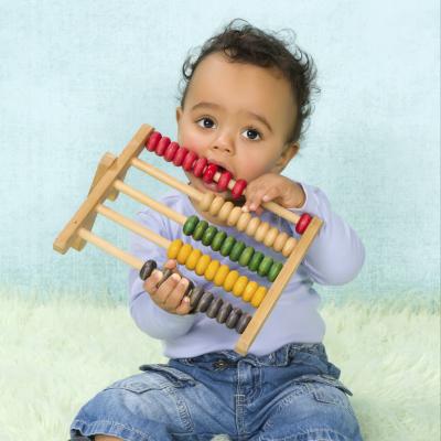 Child playing with toy. Photo credit: Studio-Annika / Shutterstock