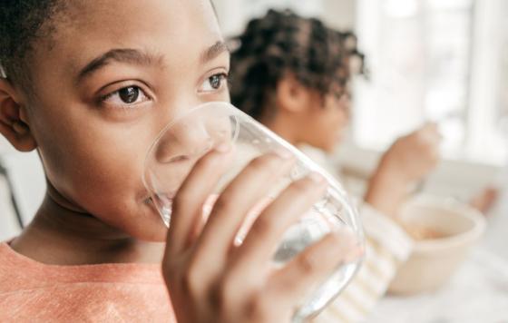 Child drinking water from glass